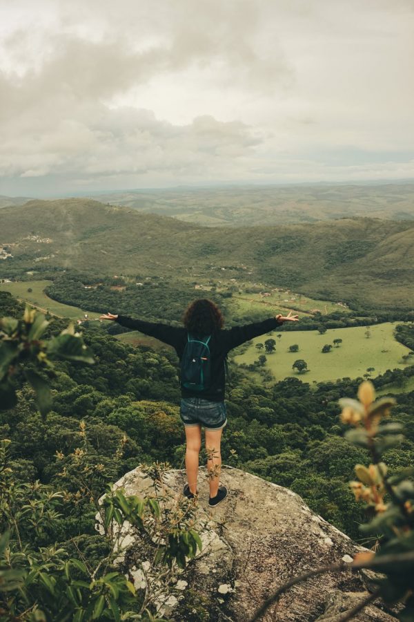 Girl on a Mountain, arms outstretched